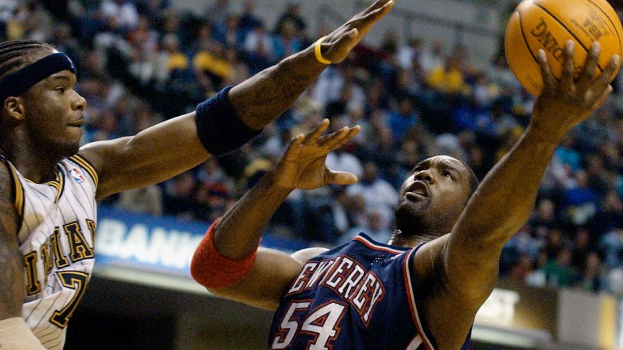 FILE - New Jersey Nets forward Rodney Rogers puts up a shot against Indiana Pacers forward Jermaine O'Neal during the first quarter of a basketball game in Indianapolis, April 9, 2004.