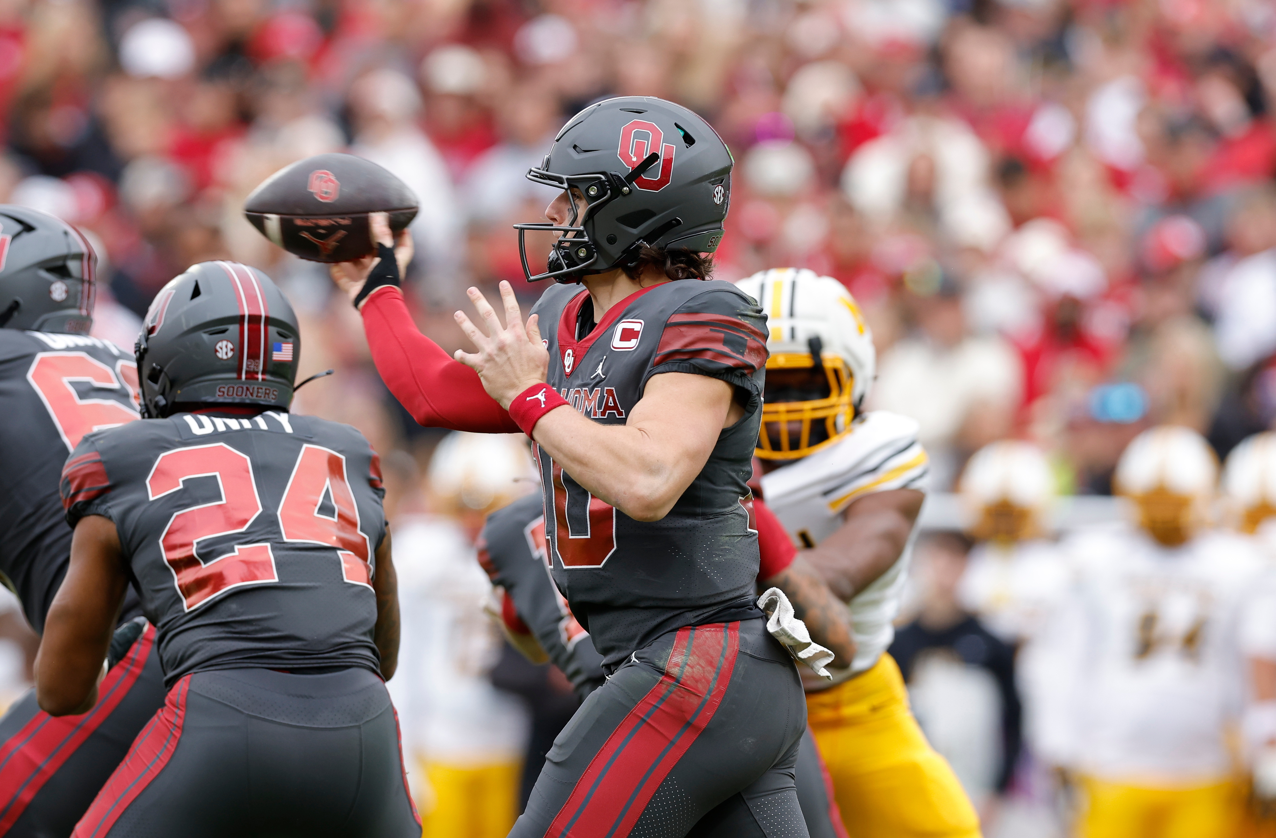 Oklahoma quarterback John Mateer (10) passes against Missouri during the first half of an NCAA college football game Saturday, Nov. 22, 2025, in Norman, Okla. 