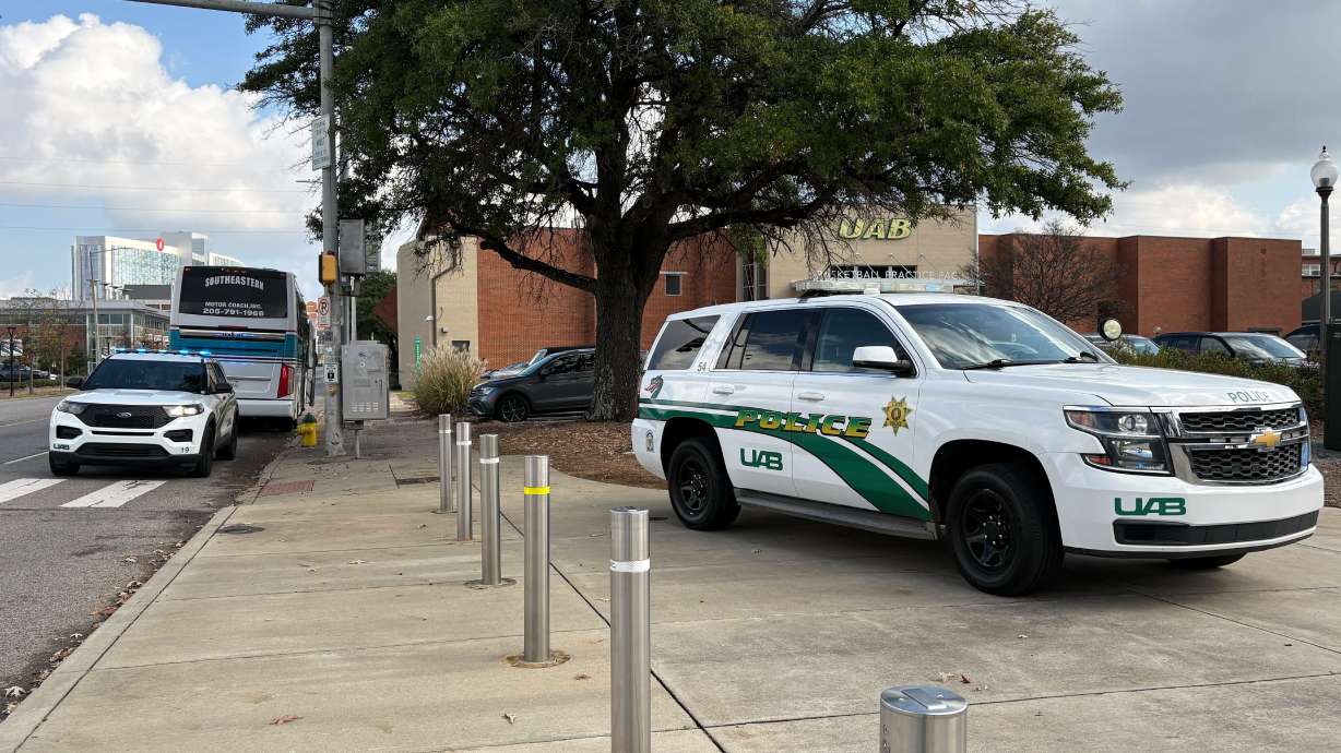 University of Alabama at Birmingham police attend to the scene of a stabbing Saturday, Nov. 22, 2025, at the campus Football Operations Center in Birmingham, Ala.