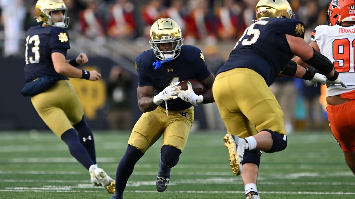 Notre Dame running back Jeremiyah Love (4) rushes during the first quarter of an NCAA football game against Syracuse, Saturday, Nov. 22, 2025, in South Bend, Ind.