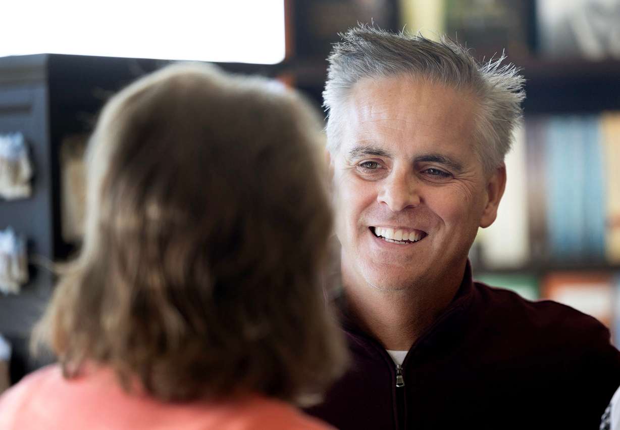 Author Jason Wright chats with a fan at Deseret Book in Spanish Fork on Nov. 6.