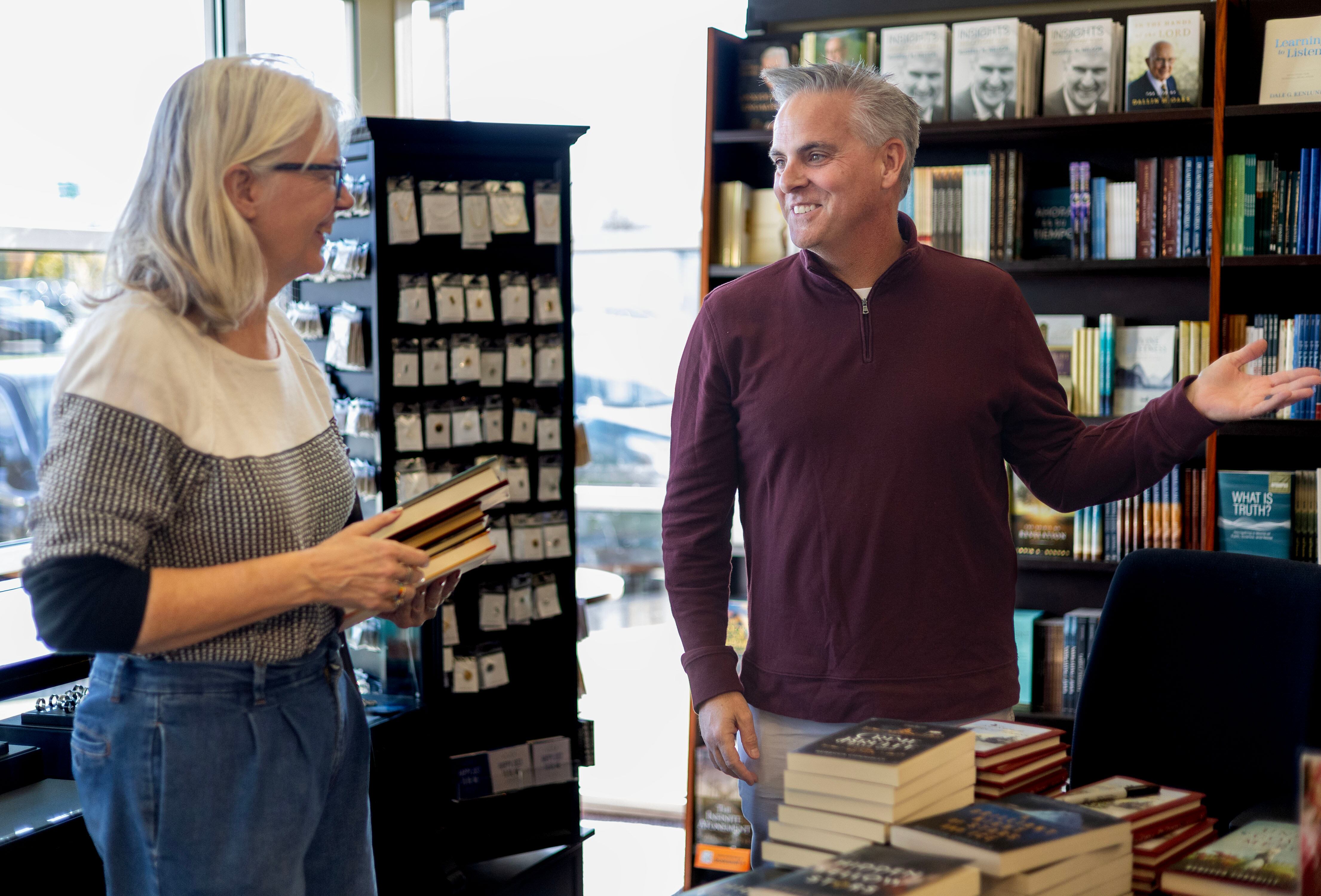 Shannon Hokanson speaks with author Jason Wright at Deseret Book in Spanish Fork on Nov. 6.