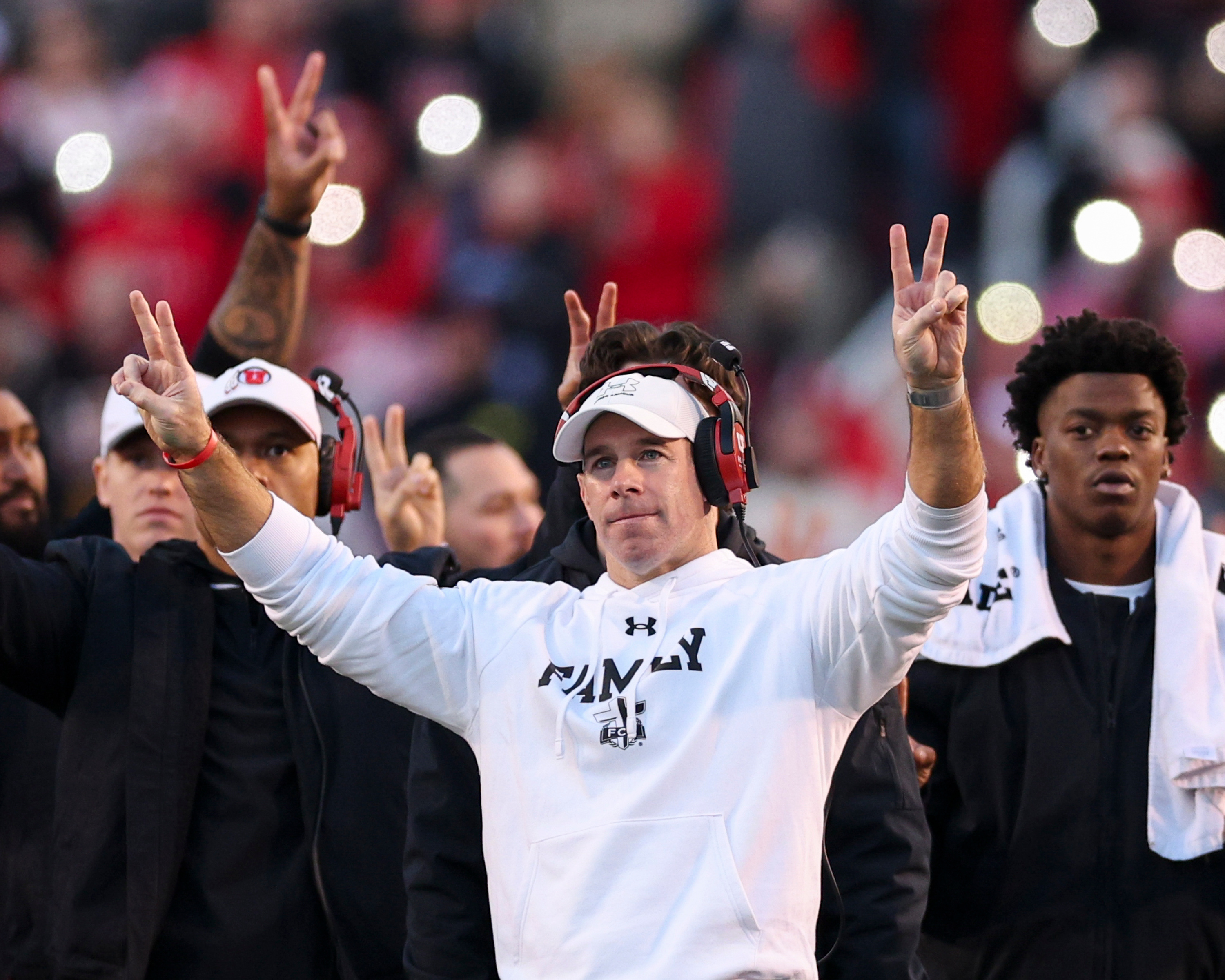 Utah defensive coordinator Morgan Scalley holds up two fingers on each hand for the “Utah 22 Forever” tribute during the third quarter break to honor late Utah players Ty Jordan and Aaron Lowe during an NCAA football game against the Kansas State Wildcats held at Rice-Eccles Stadium in Salt Lake City on Saturday, Nov. 22, 2025.