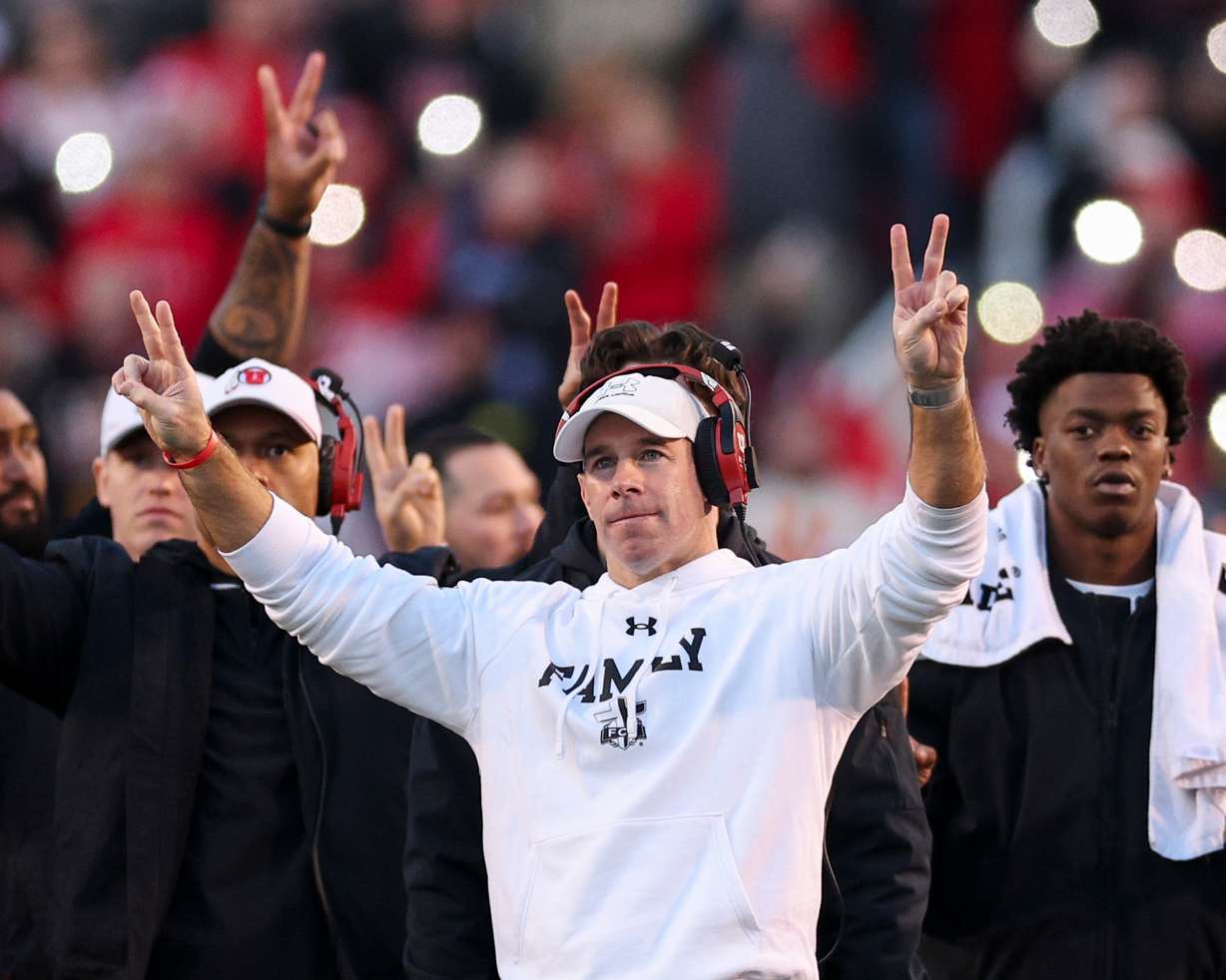 Utah defensive coordinator Morgan Scalley holds up two fingers on each hand for the “Utah 22 Forever” tribute during the third quarter break to honor late Utah players Ty Jordan and Aaron Lowe during an NCAA football game against the Kansas State Wildcats held at Rice-Eccles Stadium in Salt Lake City on Saturday, Nov. 22, 2025.