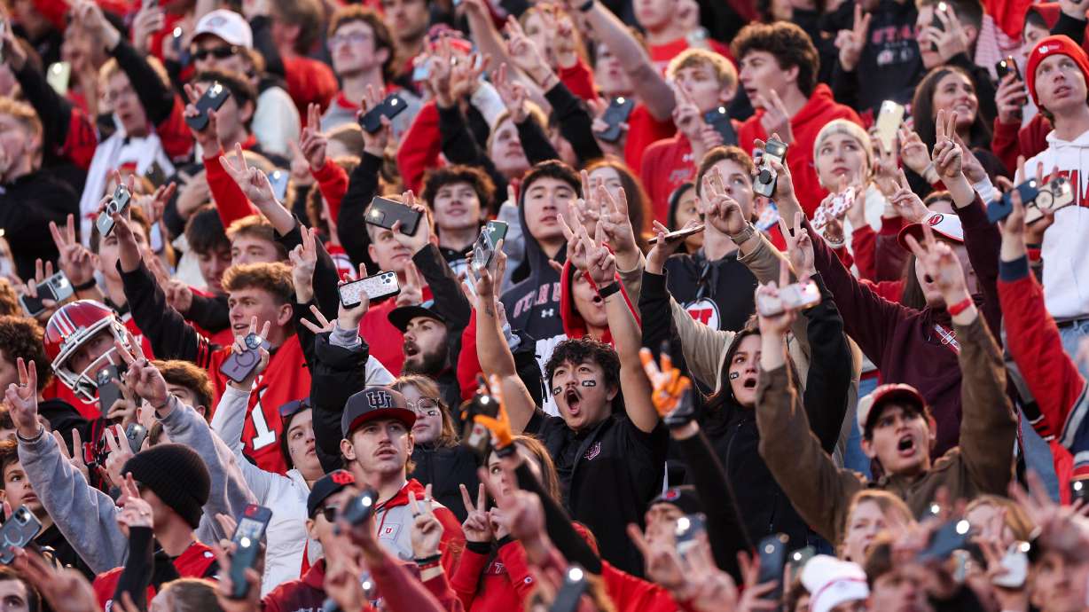 Fans hold up two fingers on each hand for the “Utah 22 Forever” tribute during the third quarter break to honor late Utah players Ty Jordan and Aaron Lowe during an NCAA football game against the Kansas State Wildcats held at Rice-Eccles Stadium in Salt Lake City on Saturday, Nov. 22, 2025.