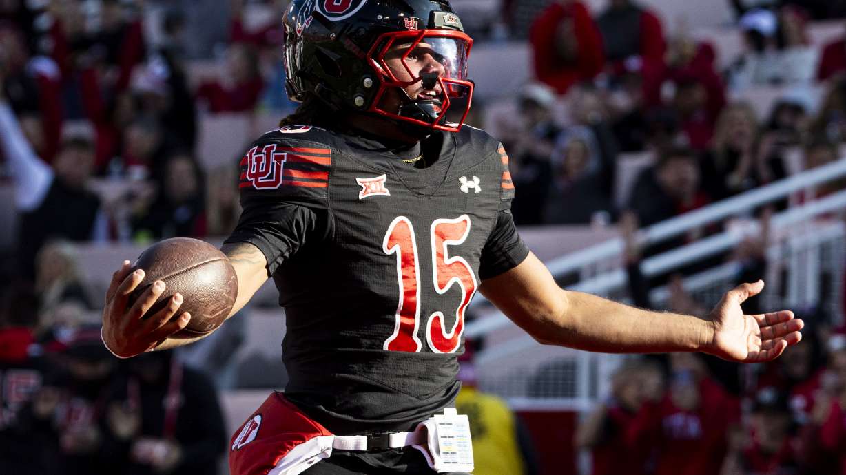 Utah quarterback Byrd Ficklin (15) celebrates his touchdown against the Kansas State Wildcats during an NCAA football game held at Rice-Eccles Stadium in Salt Lake City on Saturday, Nov. 22, 2025.