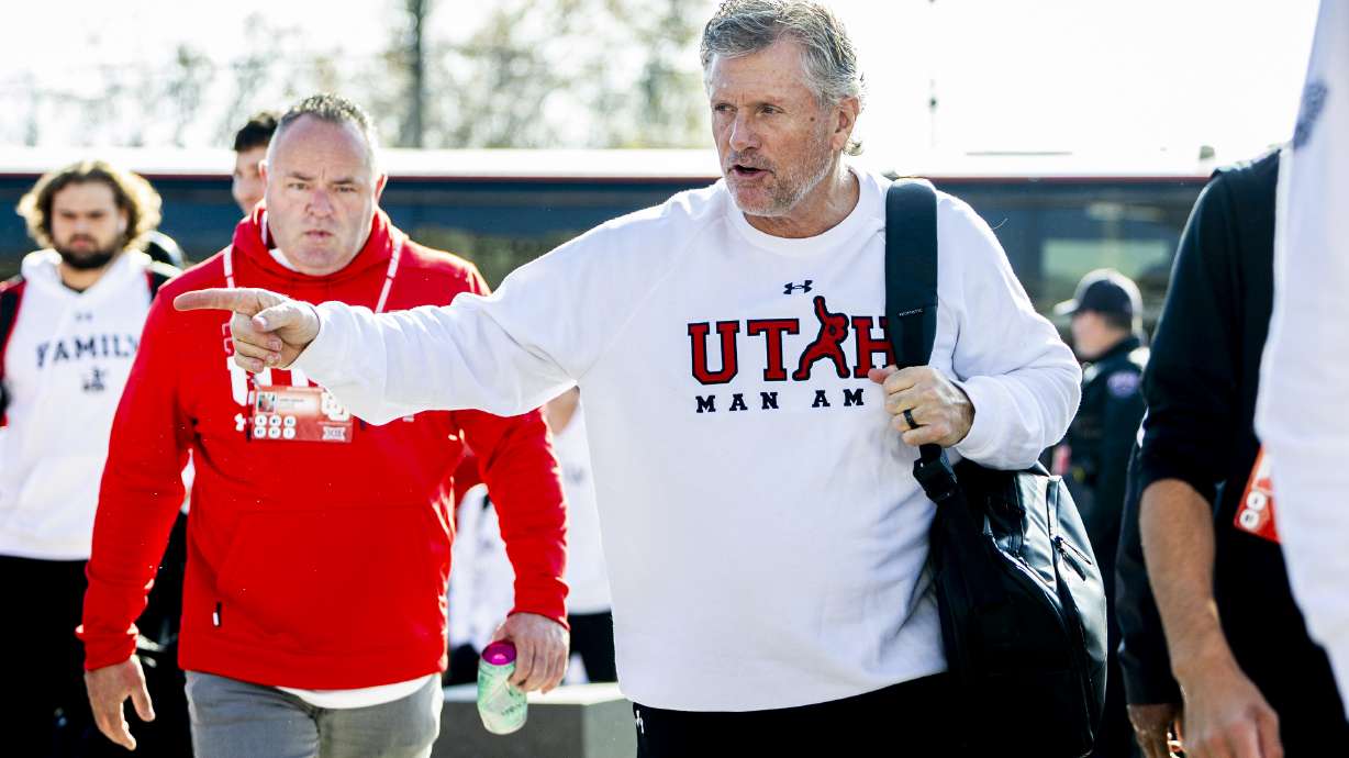 Utah head coach Kyle Whittingham greets fans as he makes his way into Rice-Eccles Stadium with the rest of the team before an NCAA football game against the Kansas State Wildcats in Salt Lake City on Saturday, Nov. 22, 2025.
