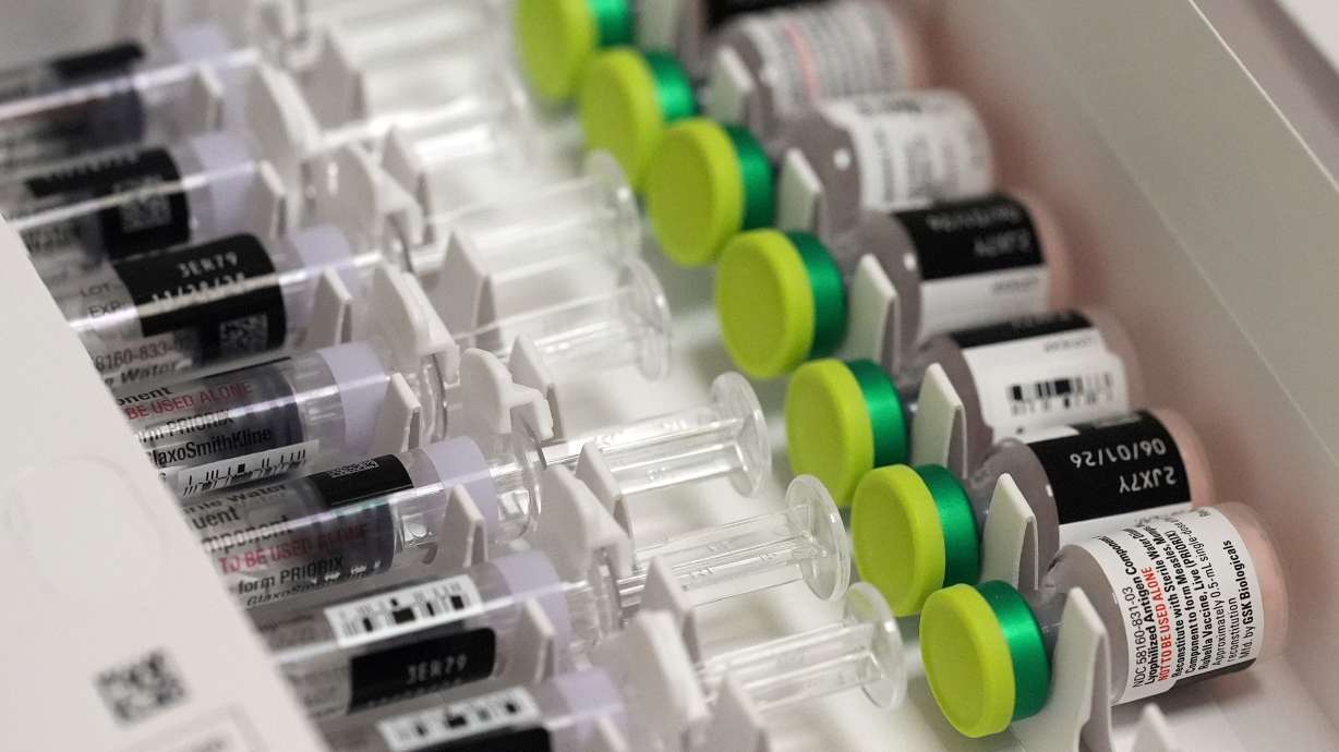 Doses of the measles, mumps, and rubella vaccine (MMR) are displayed in a box at a CVS Pharmacy, Sept. 9, in Miami.