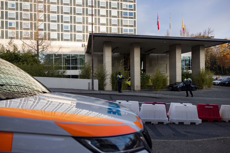 Diplomatic security officers secure the entrance of the InterContinental hotel as U.S. and Ukrainian officials prepare for closed-door talks, with the exact time and location undisclosed, in Geneva, Switzerland, Sunday.
