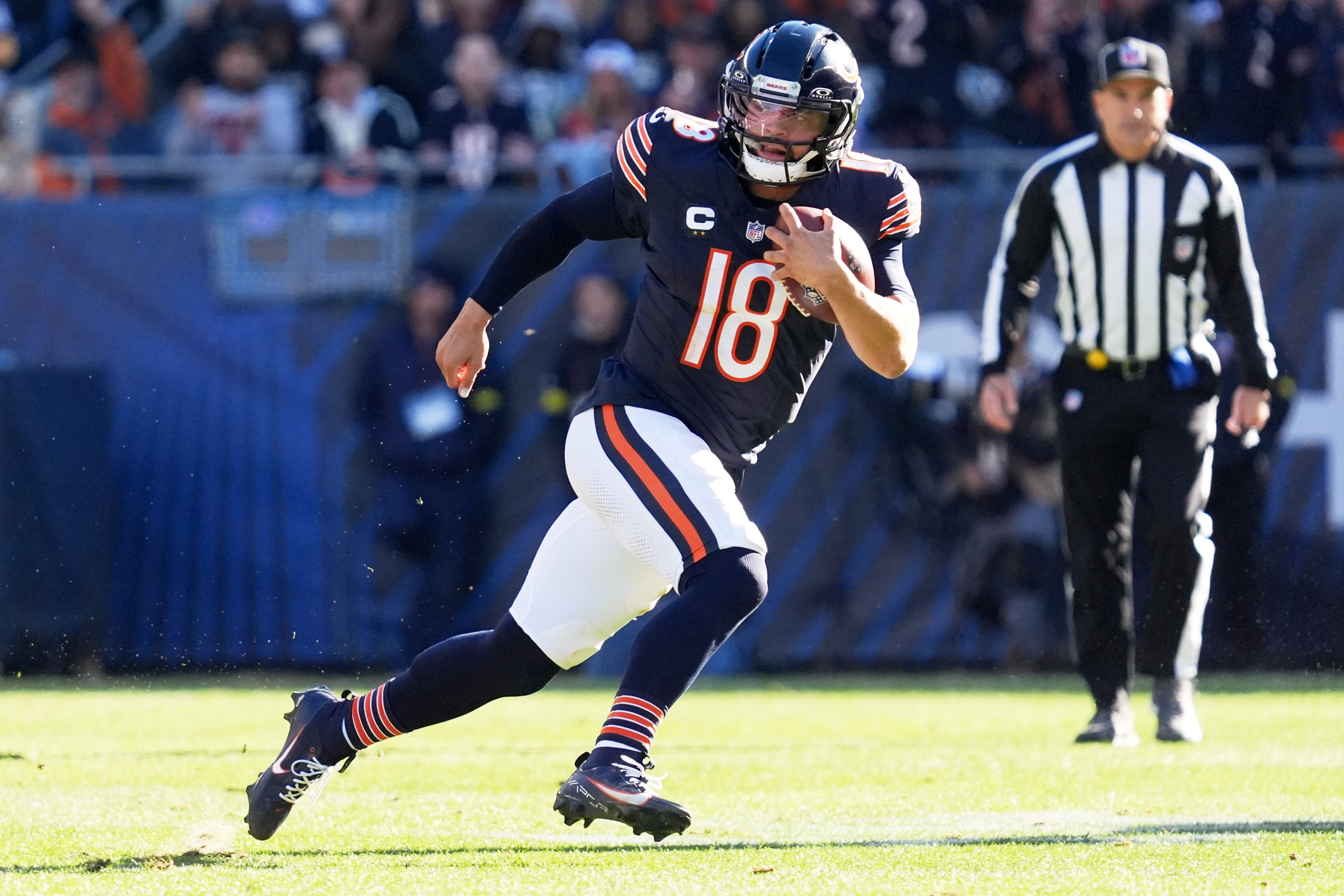 Chicago Bears quarterback Caleb Williams (18) carries the ball during the first half of an NFL football game against the Pittsburgh Steelers, Sunday, Nov. 23, 2025, in Chicago. 