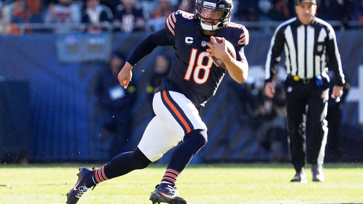 Chicago Bears quarterback Caleb Williams (18) carries the ball during the first half of an NFL football game against the Pittsburgh Steelers, Sunday, Nov. 23, 2025, in Chicago.