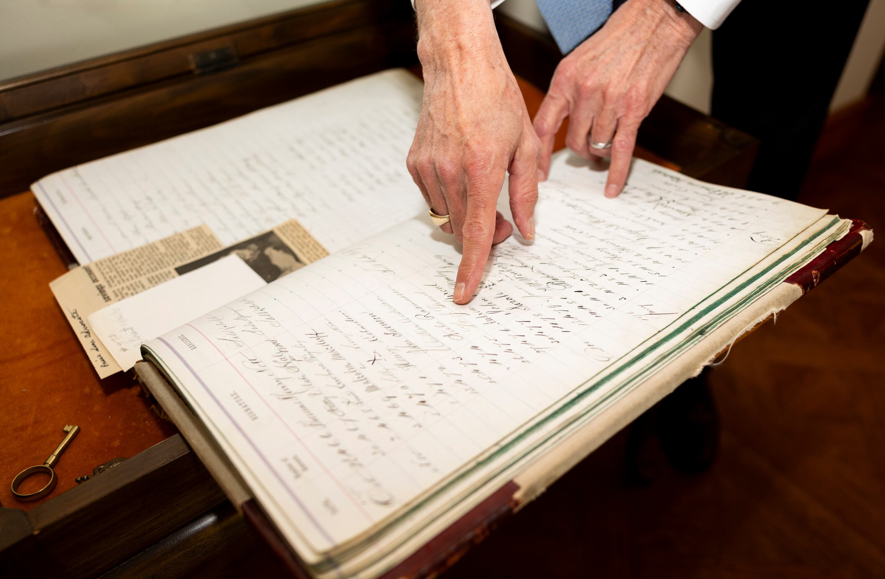 Harris Simmons, chairman and CEO of Zions Bank, points to a signature book in his office in Salt Lake City after an interview on Nov. 10.