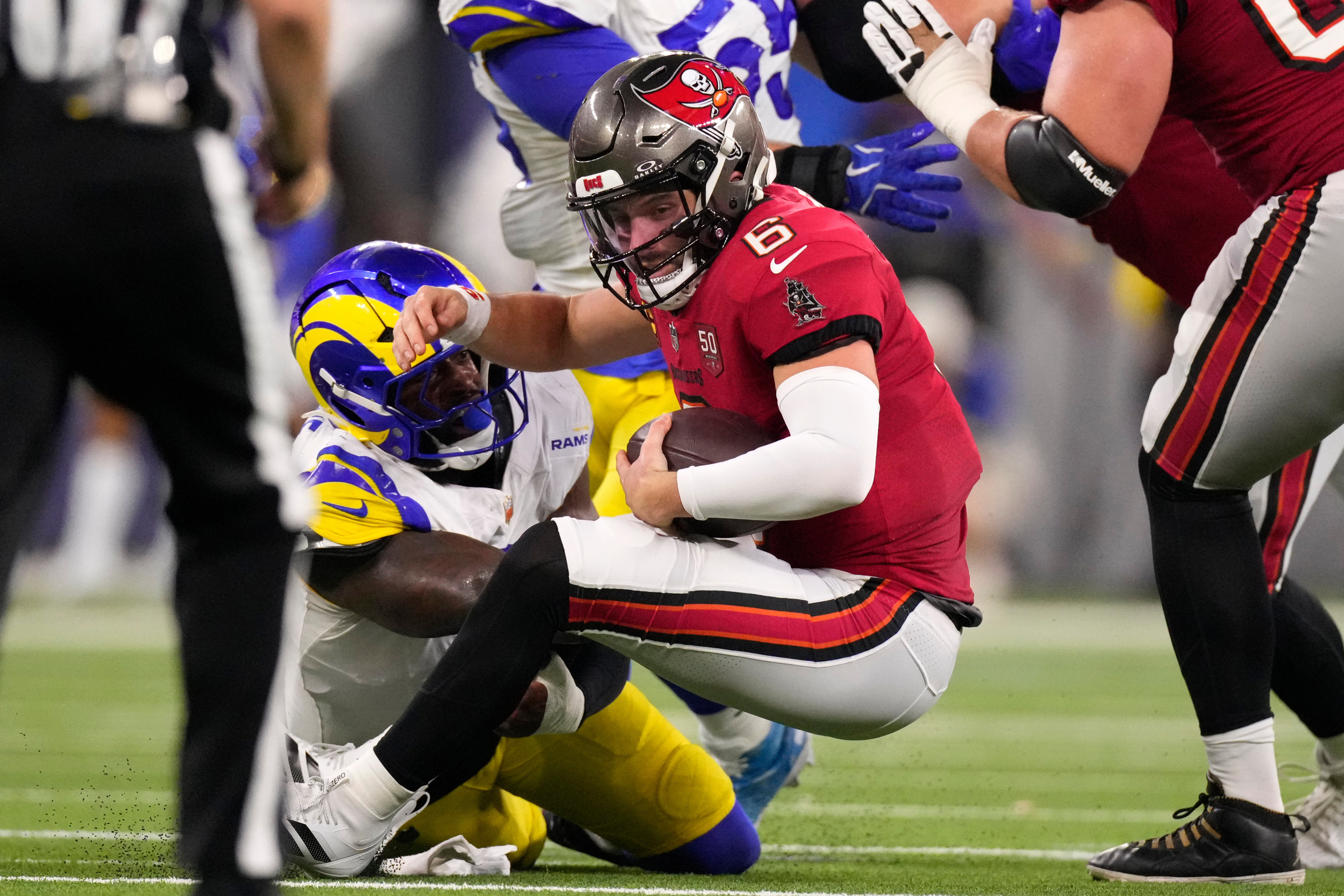 Los Angeles Rams linebacker Jared Verse tackles Tampa Bay Buccaneers quarterback Baker Mayfield during the first half of an NFL football game, Sunday, Nov. 23, 2025, in Inglewood, Calif. 