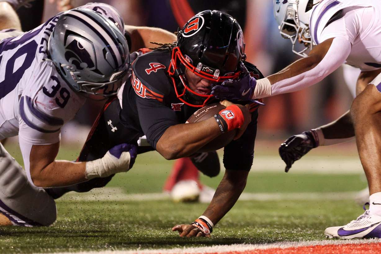 Utah quarterback Devon Dampier (4) is tackled short of the goal line during the second half of an NCAA football game against the Kansas State Wildcats held at Rice-Eccles Stadium in Salt Lake City on Saturday.