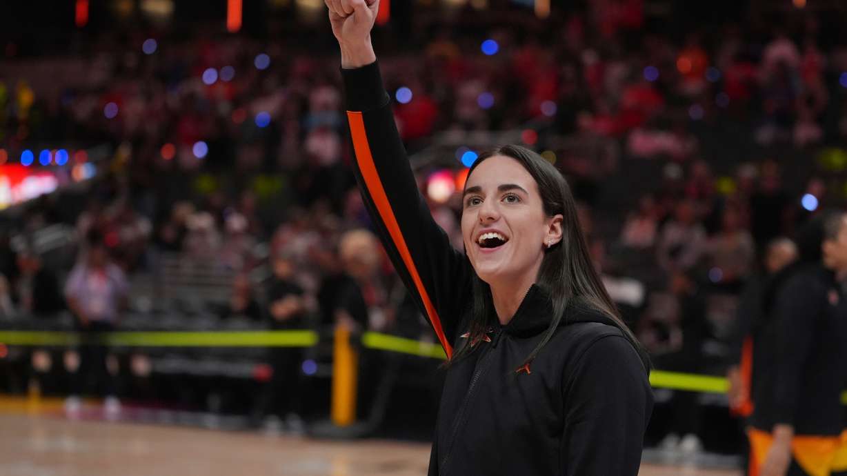 FILE - Indiana Fever's Caitlin Clark reacts to fans before the WNBA All-Star basketball game, Saturday, July 19, 2025, in Indianapolis.
