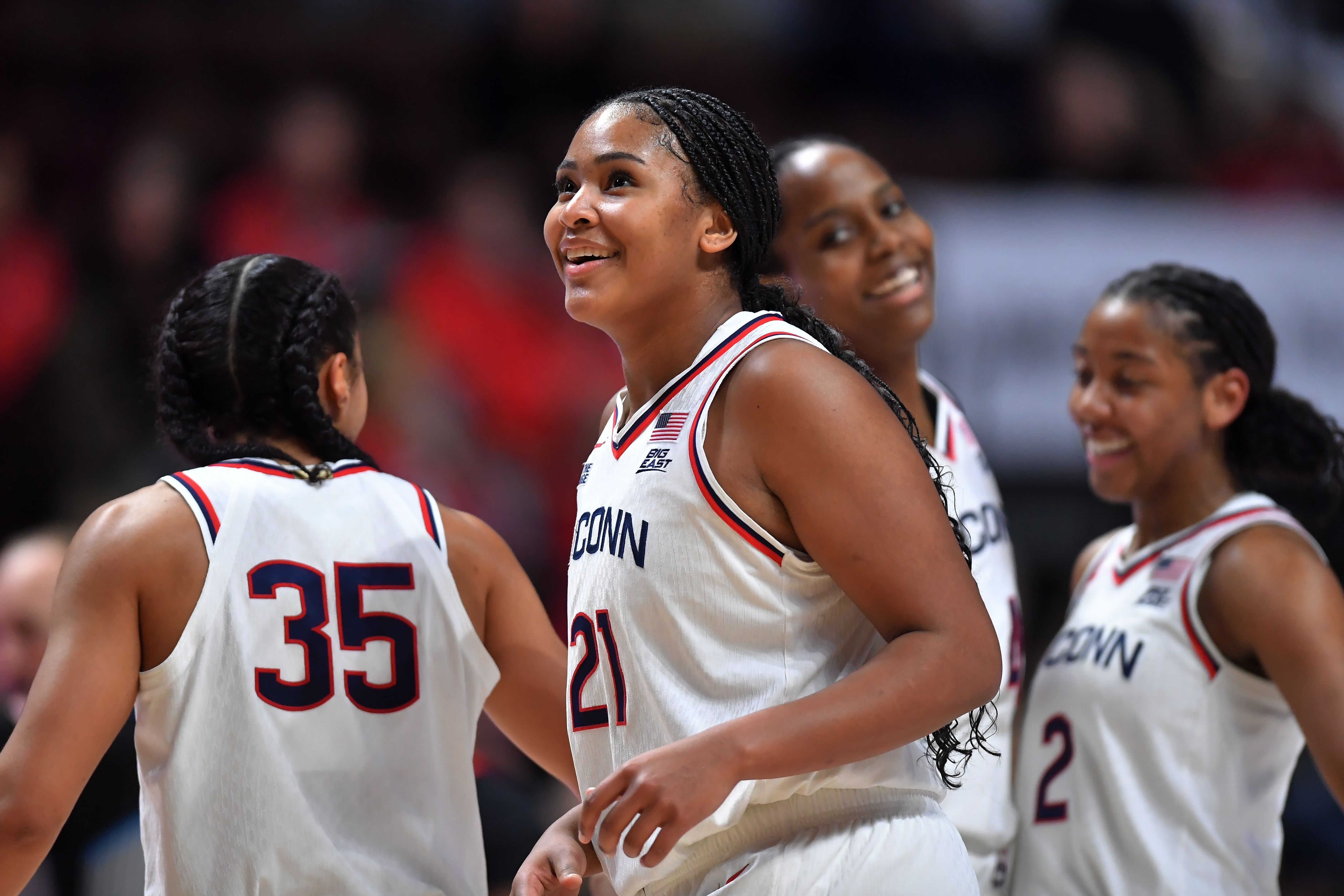 UConn forward Sarah Strong (21) celebrates with guards Azzi Fudd (35) and KK Arnold (2) as they lead Utah in the second half of an NCAA college basketball game, Sunday, Nov. 23, 2025, in Uncasville, Conn.