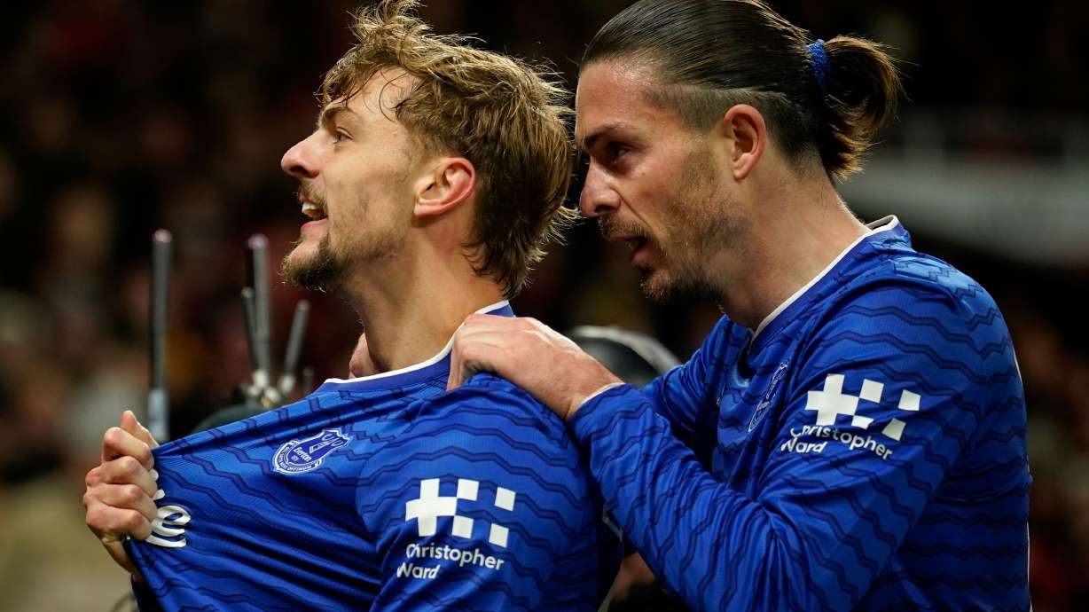 Everton's Kiernan Dewsbury-Hall, left, celebrates with Jack Grealish after scoring the opening goal during the English Premier League soccer match between Manchester United and Everton in Manchester, England, Monday, Nov. 24, 2025.
