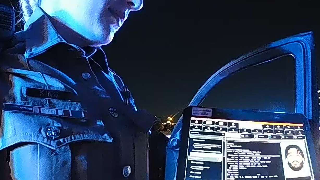 This image taken from video provided by Texas Department of Public Safety shows bodycam footage of law enforcement looking up information about Cowboys defensive end Marshawn Kneeland while searching for him, Nov. 5, 2025, in Frisco, Texas.