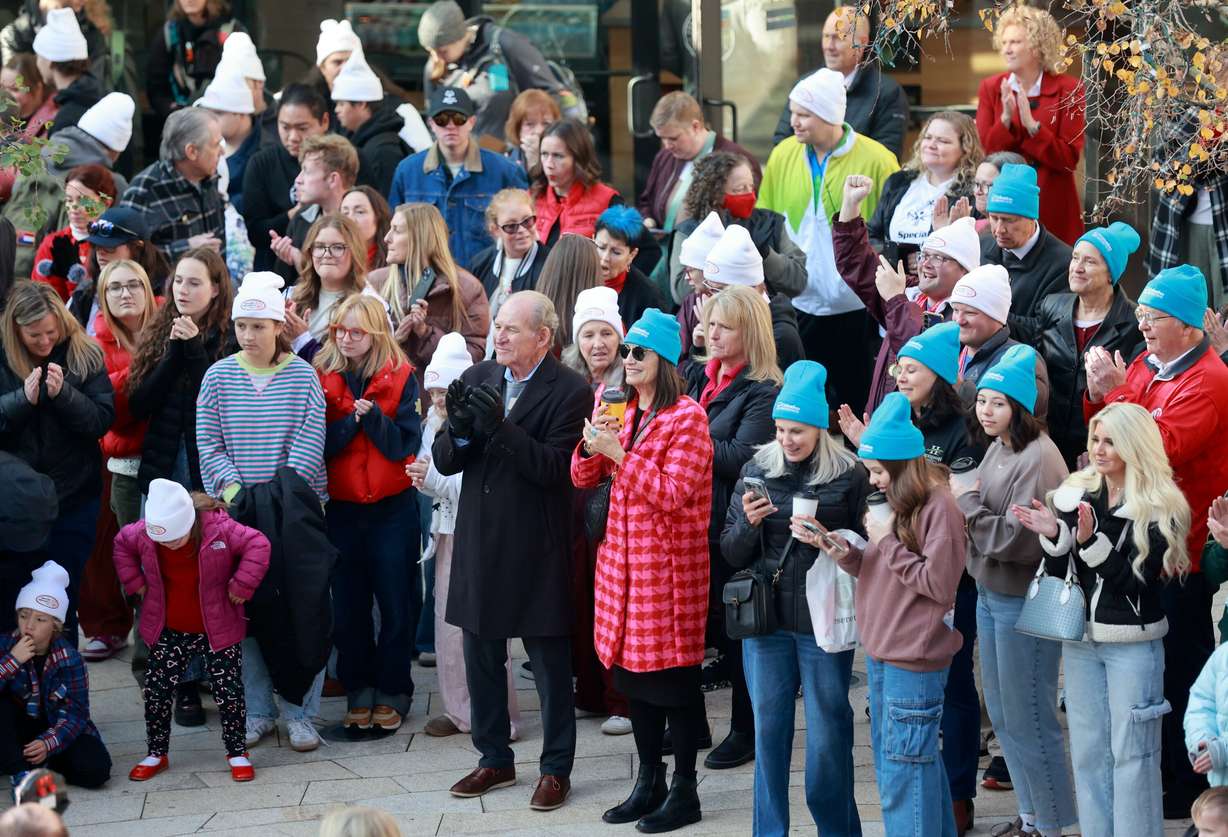 People attend the kickoff celebration for the Light the World Giving Machines at City Creek Center in Salt Lake City on Monday.