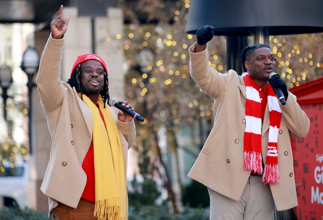 Oba Bonner and Yahosh Bonner sing at the kickoff celebration for the Light the World Giving Machines at City Creek Center in Salt Lake City on Monday.
