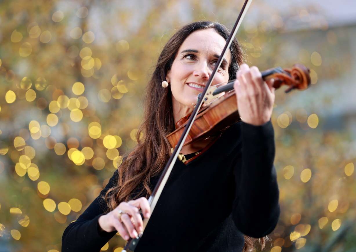 Jenny Oaks Baker performs at the kickoff celebration for the Light the World Giving Machines at City Creek Center in Salt Lake City on Monday.
