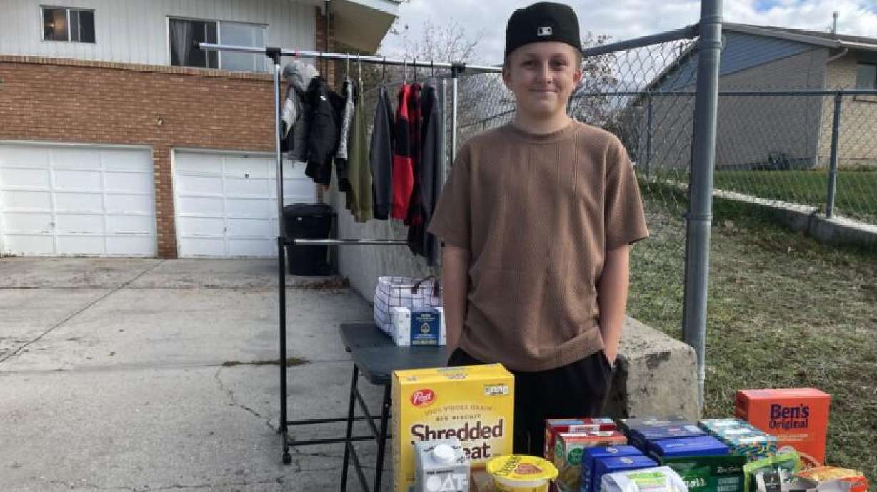 Thirteen-year-old Tate Keesler, of Brigham City, has run a donation stand for the last month. He and his mom give away donated food, hygiene products and jackets to families who need them.