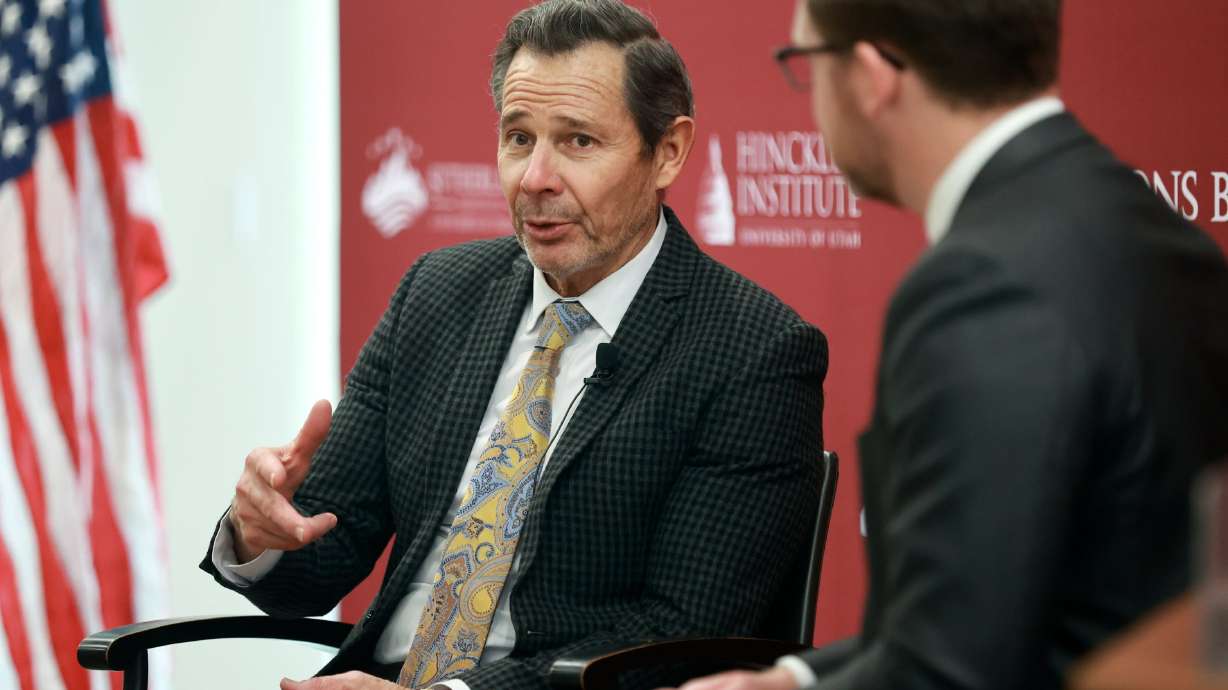 Sen. John Curtis, R-Utah, talks with Nic Dunn, Sutherland Institute vice president of strategy and senior fellow, at the Sutherland Institute of Politics Congressional Series at the University of Utah in Salt Lake City on Monday.