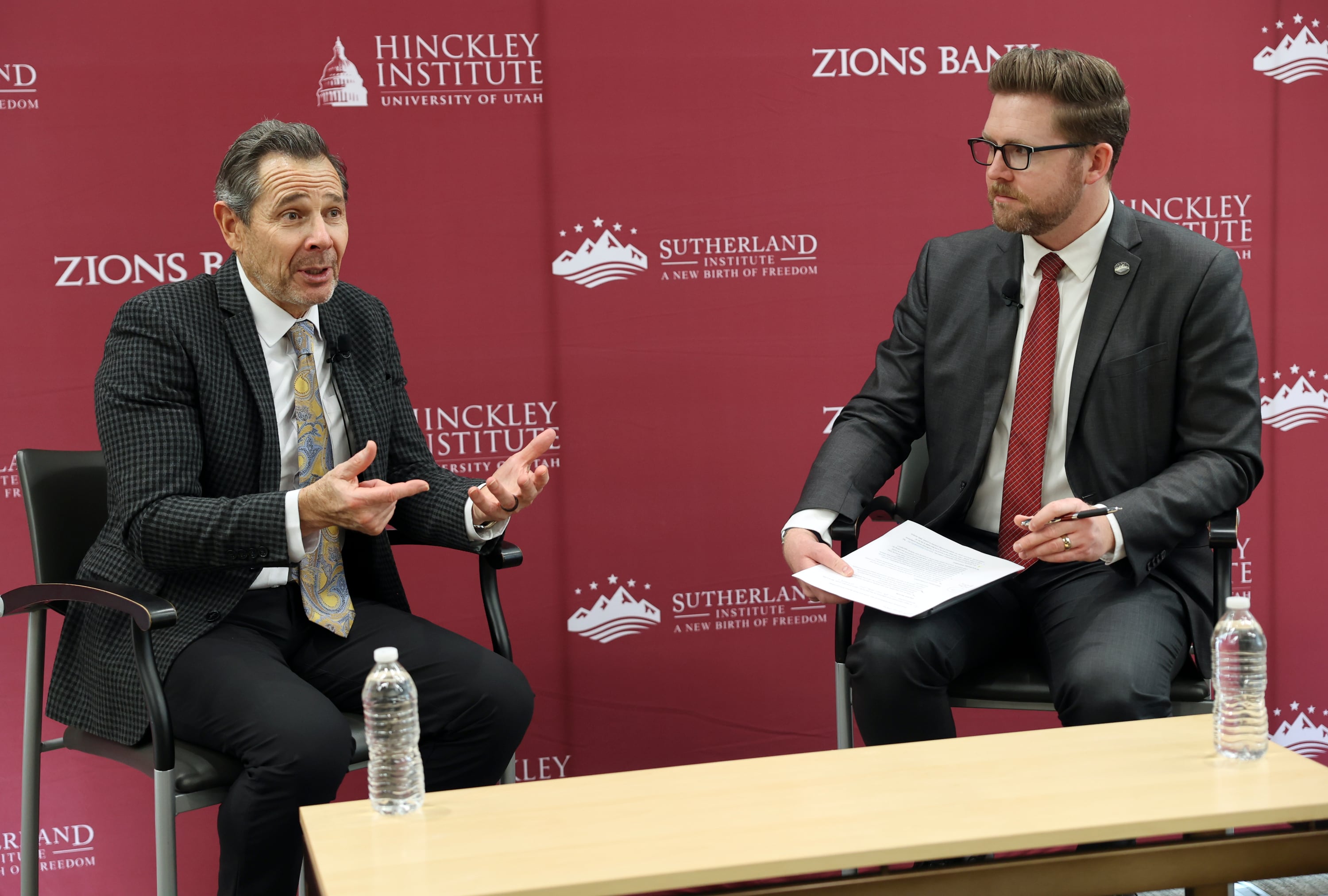 Sen. John Curtis, R-Utah, talks with Nic Dunn, Sutherland Institute vice president of Strategy and senior fellow, at the Sutherland Institute of Politics Congressional Series at the University of Utah in Salt Lake City on Monday.