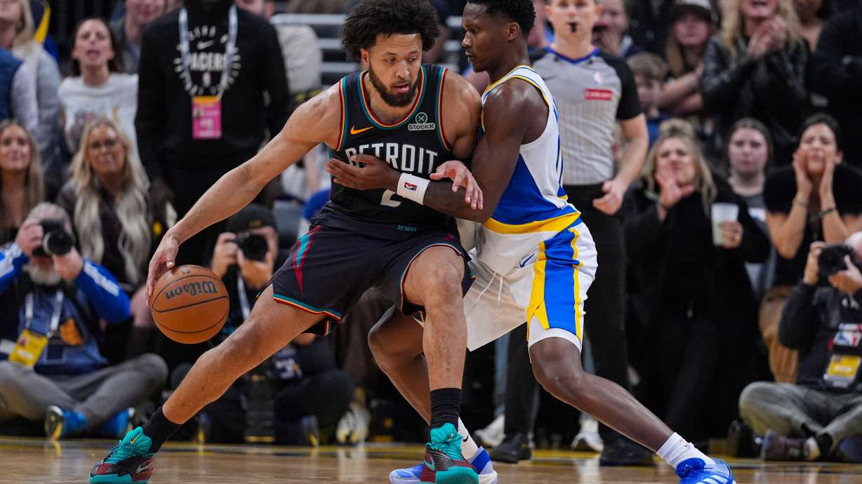 Detroit Pistons guard Cade Cunningham (2) drives on Indiana Pacers guard Bennedict Mathurin (00) during the second half of an NBA basketball game in Indianapolis, Monday, Nov. 24, 2025.