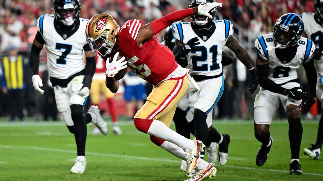 San Francisco 49ers wide receiver Jauan Jennings runs for a touchdown against the Carolina Panthers during the first half an NFL football game, Monday, Nov. 24, 2025, in Santa Clara, Calif.