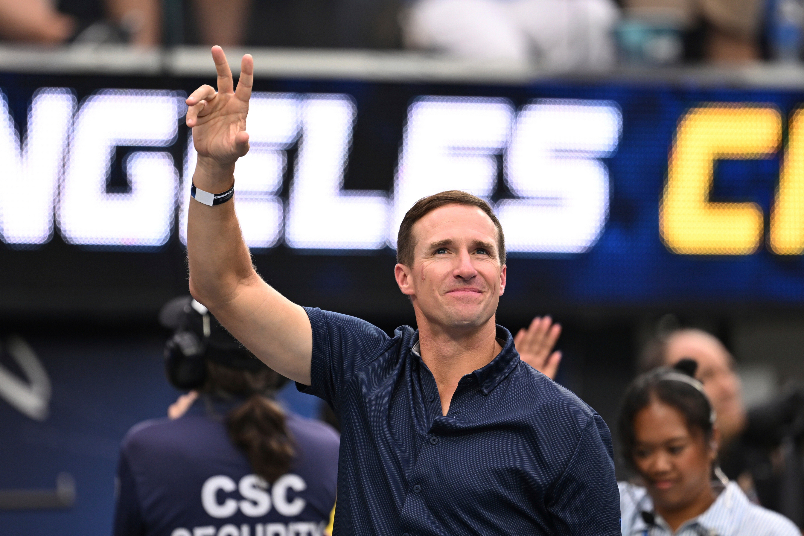 FILE - Former quarterbackDrew Brees waves to the crowd during the first half of an NFL football game between the Los Angeles Chargers and the Denver Broncos, Sunday, Sept. 21, 2025, in Inglewood, Calif.