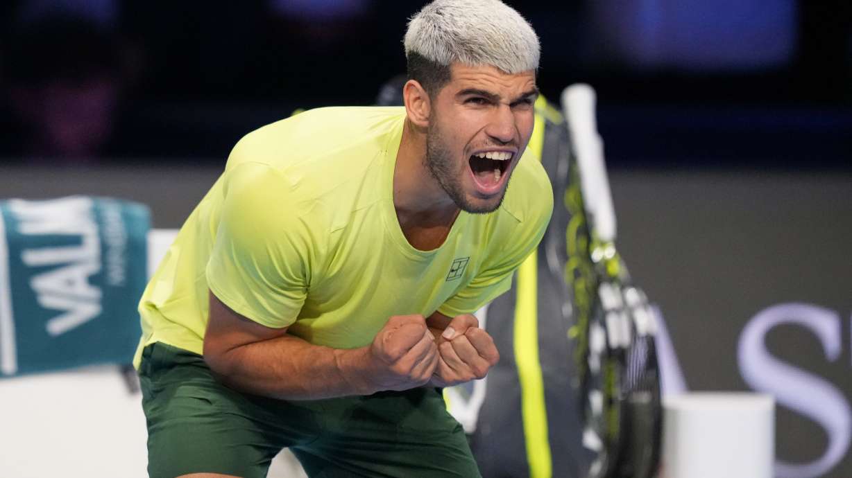 Spain's Carlos Alcaraz celebrates after winning against Italy's Lorenzo Musetti during the tennis match of the ATP World Tour Finals, in Turin, Italy, Thursday, Nov. 13, 2025.