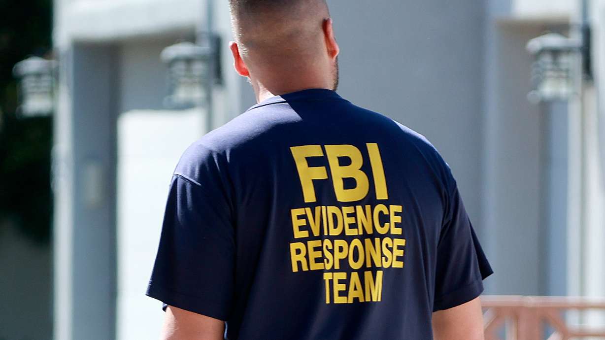 An FBI member works in Washington, Washington County, on Sept. 12. An Ohio man faces federal charges of child sexual abuse after investigators say they found evidence he abused children in Ohio and Utah, according to a release issued Tuesday.
