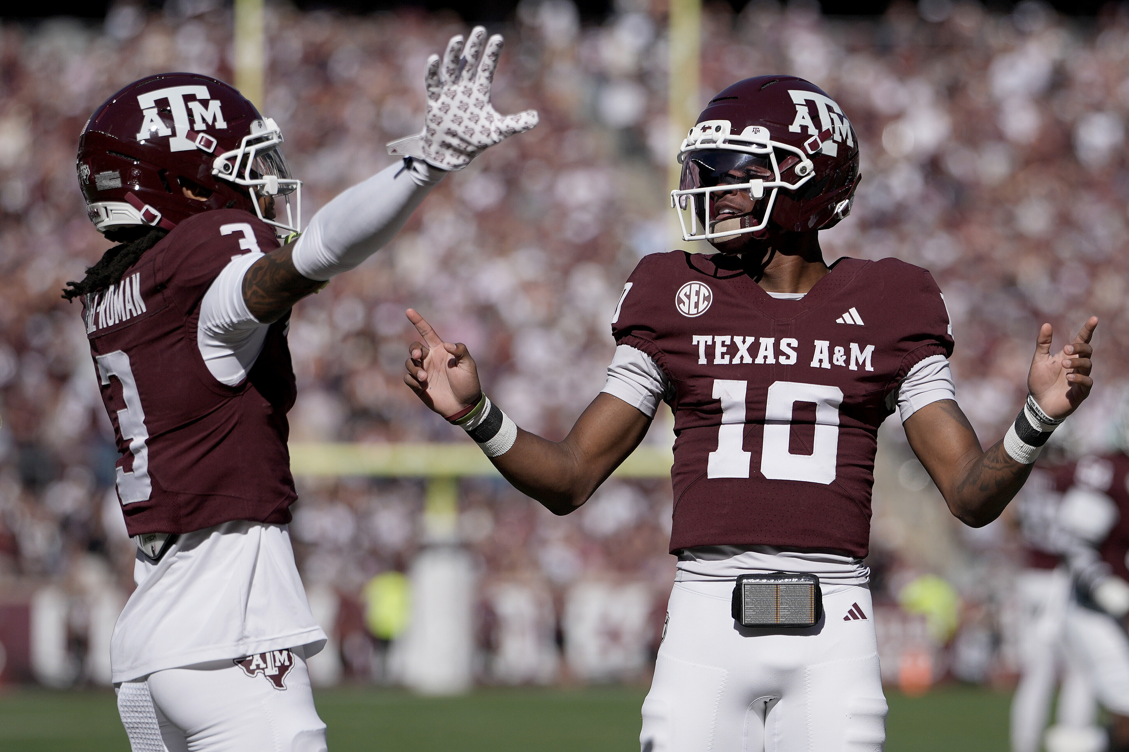 Texas A&M wide receiver Ashton Bethel-Roman (3) reacts with quarterback Marcel Reed (10) after scoring a touchdown agianst Samford during the first quarter of an NCAA college football game Saturday, Nov. 22, 2025, in College Station, Texas. 