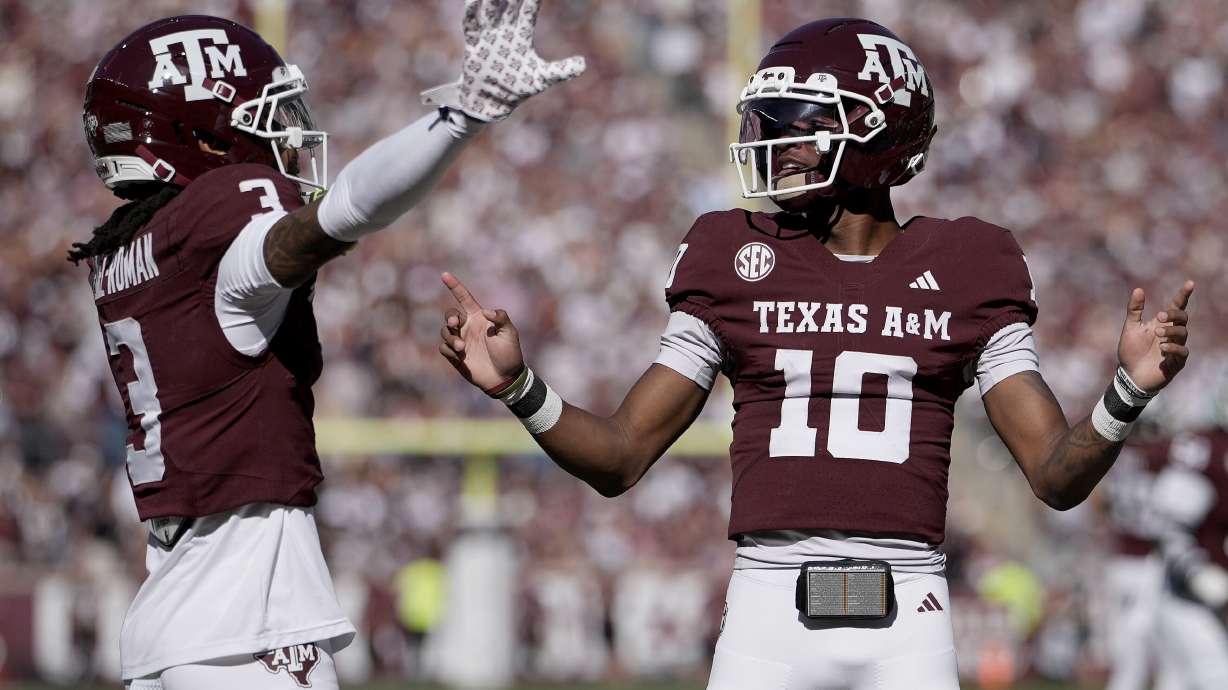 Texas A&M wide receiver Ashton Bethel-Roman (3) reacts with quarterback Marcel Reed (10) after scoring a touchdown agianst Samford during the first quarter of an NCAA college football game Saturday, Nov. 22, 2025, in College Station, Texas.