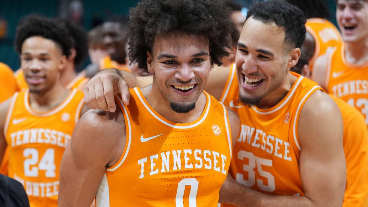 Tennessee guard Ja'Kobi Gillespie (0) and guard Ethan Burg (35) celebrate after Tennessee defeated Houston in an NCAA college basketball game in the Players Era tournament Las Vegas, Tuesday, Nov. 25, 2025.