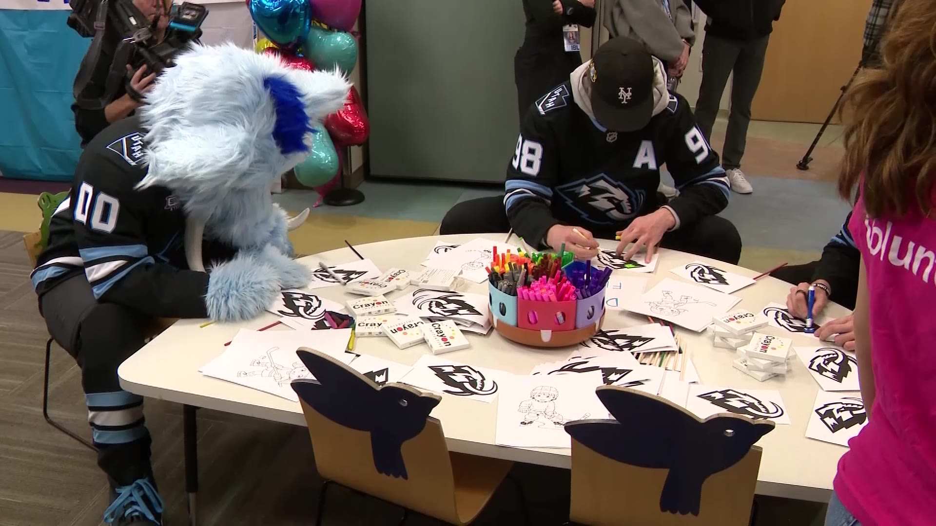 Utah Mammoth mascot, Tusky, and team member Mikhail Sergachev are pictured visiting Intermountain Primary Children’s Hospital on Tuesday. Players made friendship bracelets and slime in the team's colors with the patients.