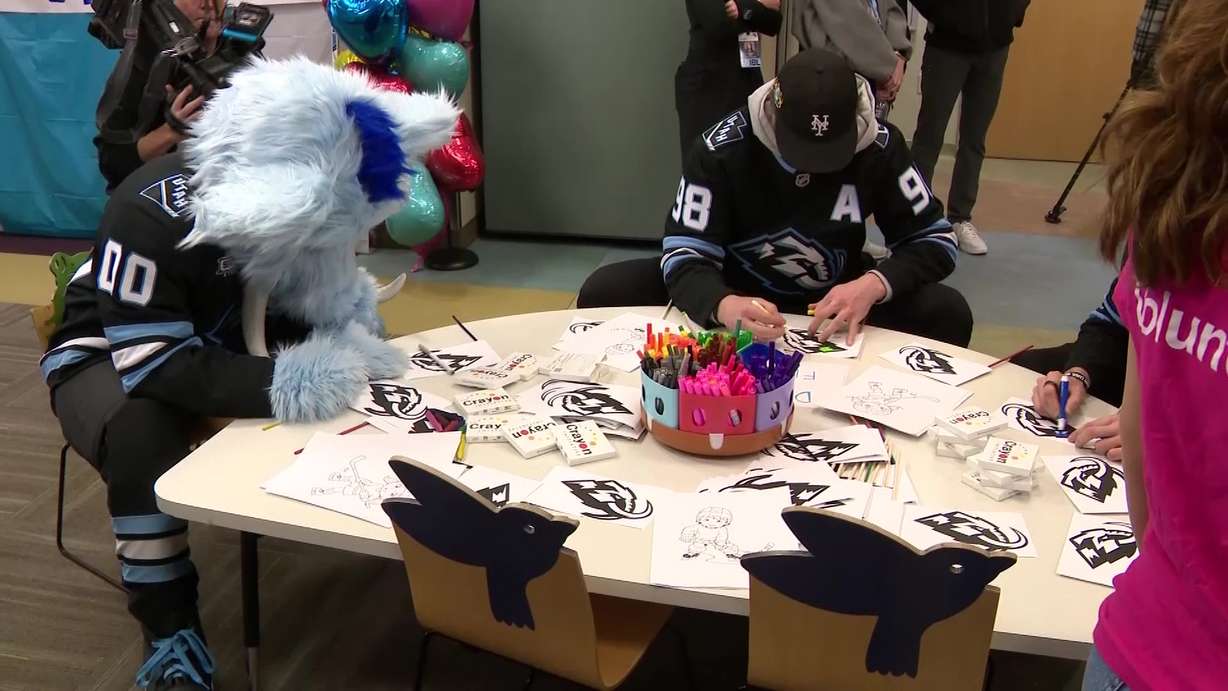 Utah Mammoth mascot, Tusky, and team member Mikhail Sergachev are pictured visiting Intermountain Primary Children’s Hospital on Tuesday. Players made friendship bracelets and slime in the team's colors with the patients.