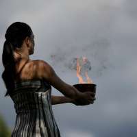Under a cloud, the Olympic flame begins its journey to the Milan Cortina Winter Olympics