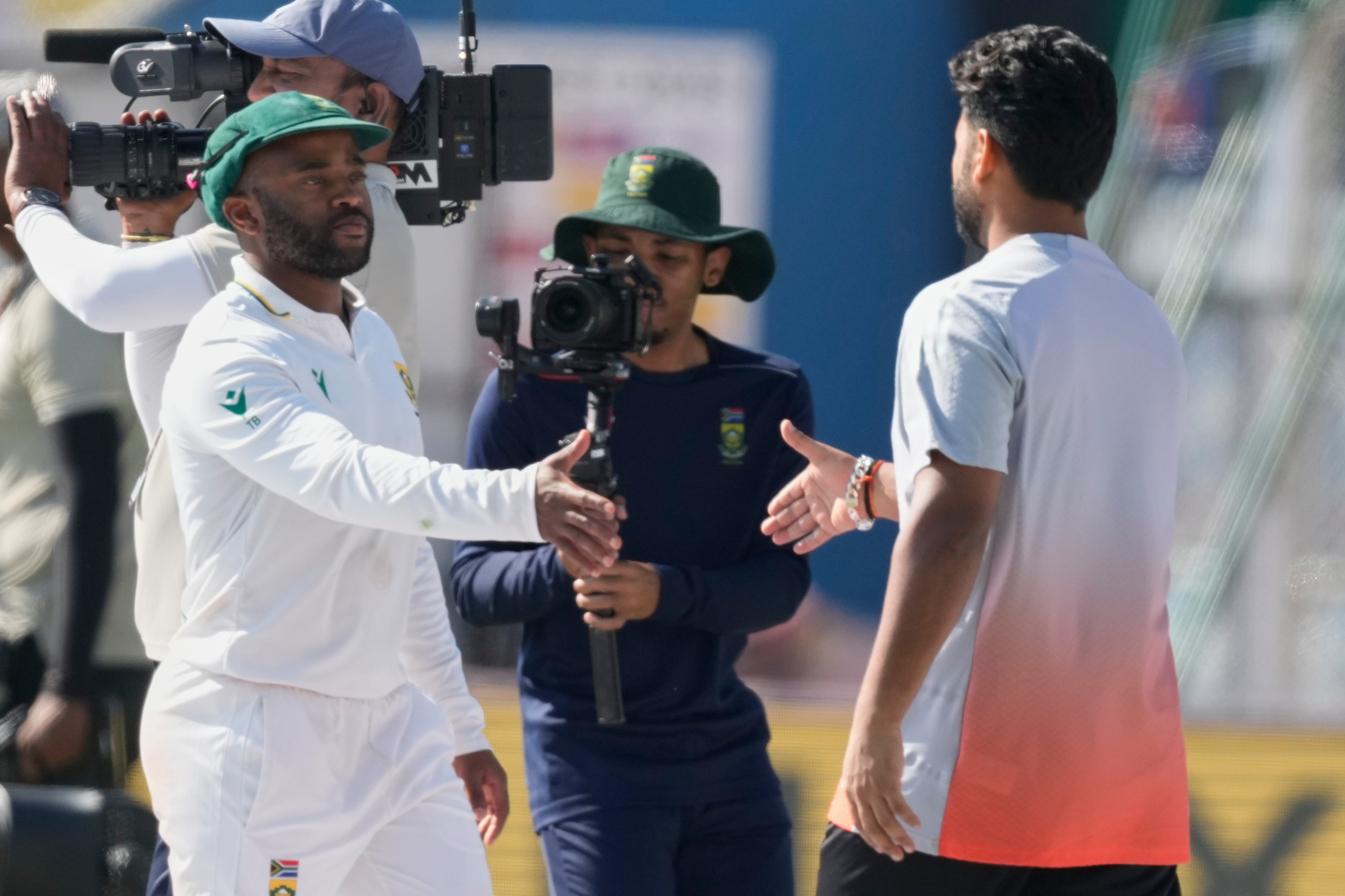 India's captain Rishab Pant, right, and South Africa's captain Temba Bavuma shake hands after South Africa wins the test series against India in Guwahati, India, Saturday, Nov. 22, 2025. 
