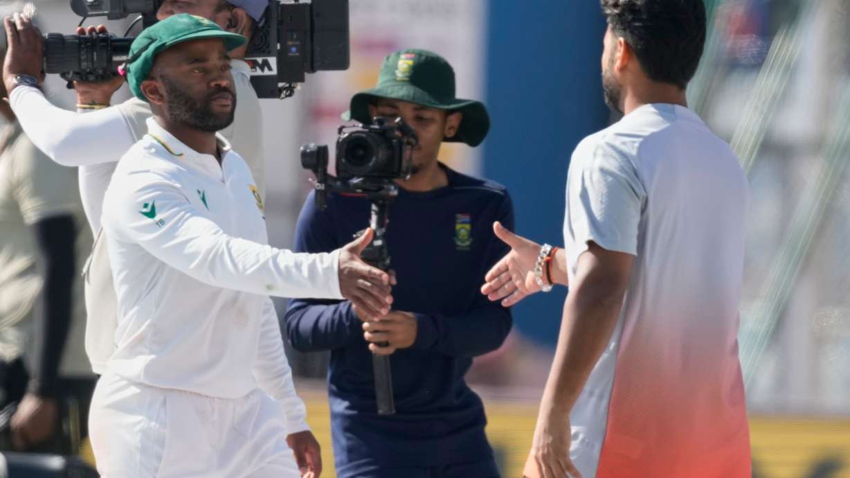 India's captain Rishab Pant, right, and South Africa's captain Temba Bavuma shake hands after South Africa wins the test series against India in Guwahati, India, Saturday, Nov. 22, 2025.