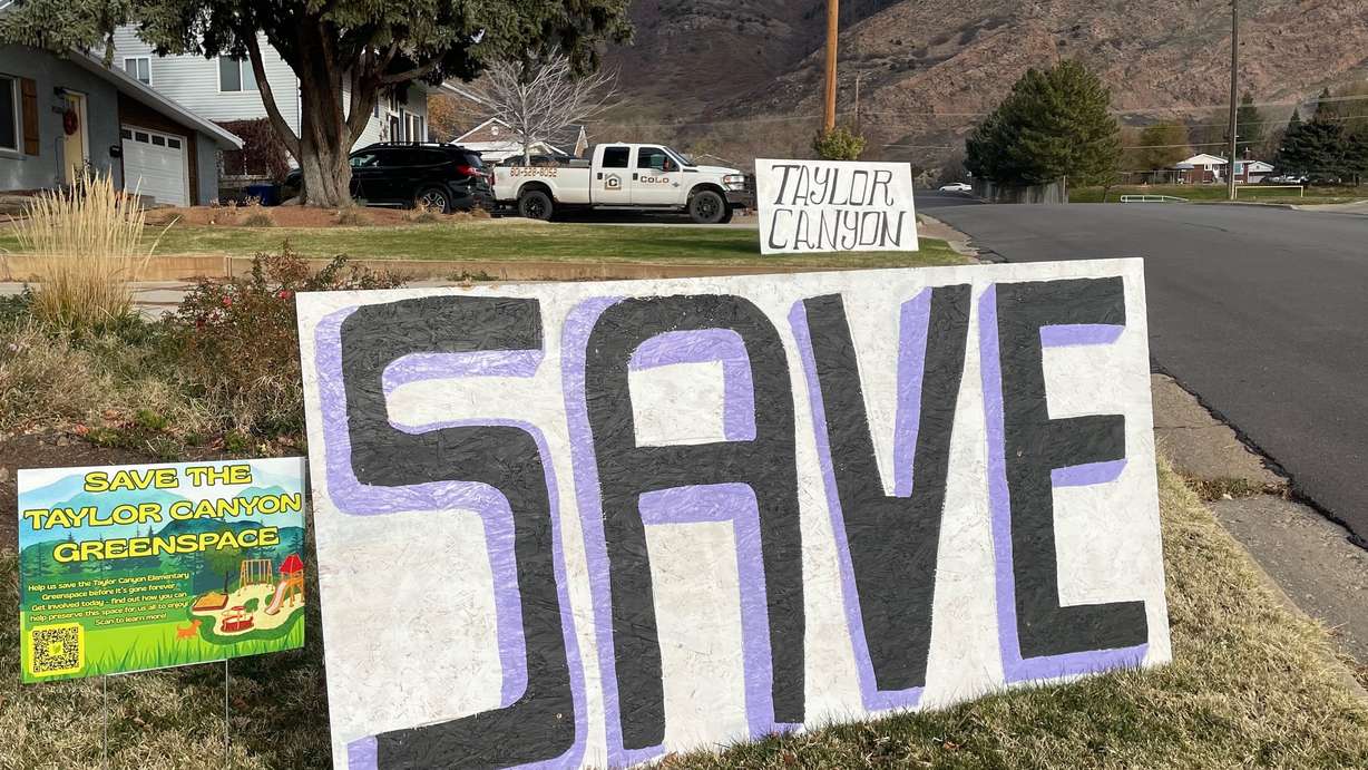 Ogden Mayor Ben Nadolski will seek acquisition of the site of a former school, Taylor Canyon Elementary, so the land can be maintained as open space. Neighbors around the site have posted yard signs like these, pictured Wednesday, pressing for such action.