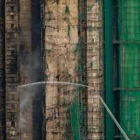 At least 75 dead as Hong Kong firefighters battle burning towers for a second day