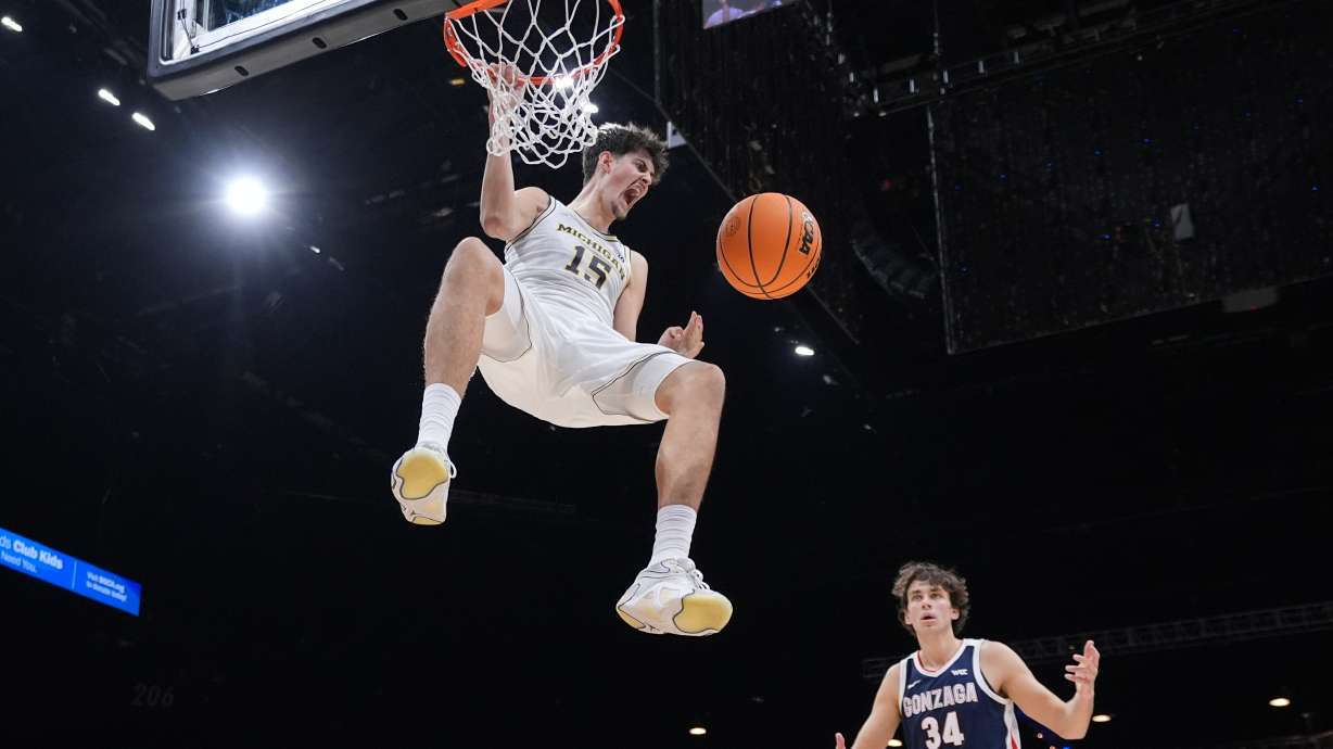 Michigan center Aday Mara (15) reacts as he scores against Gonzaga during the first half of an NCAA college basketball game in the Players Era tournament in Las Vegas, Wednesday, Nov. 26, 2025.