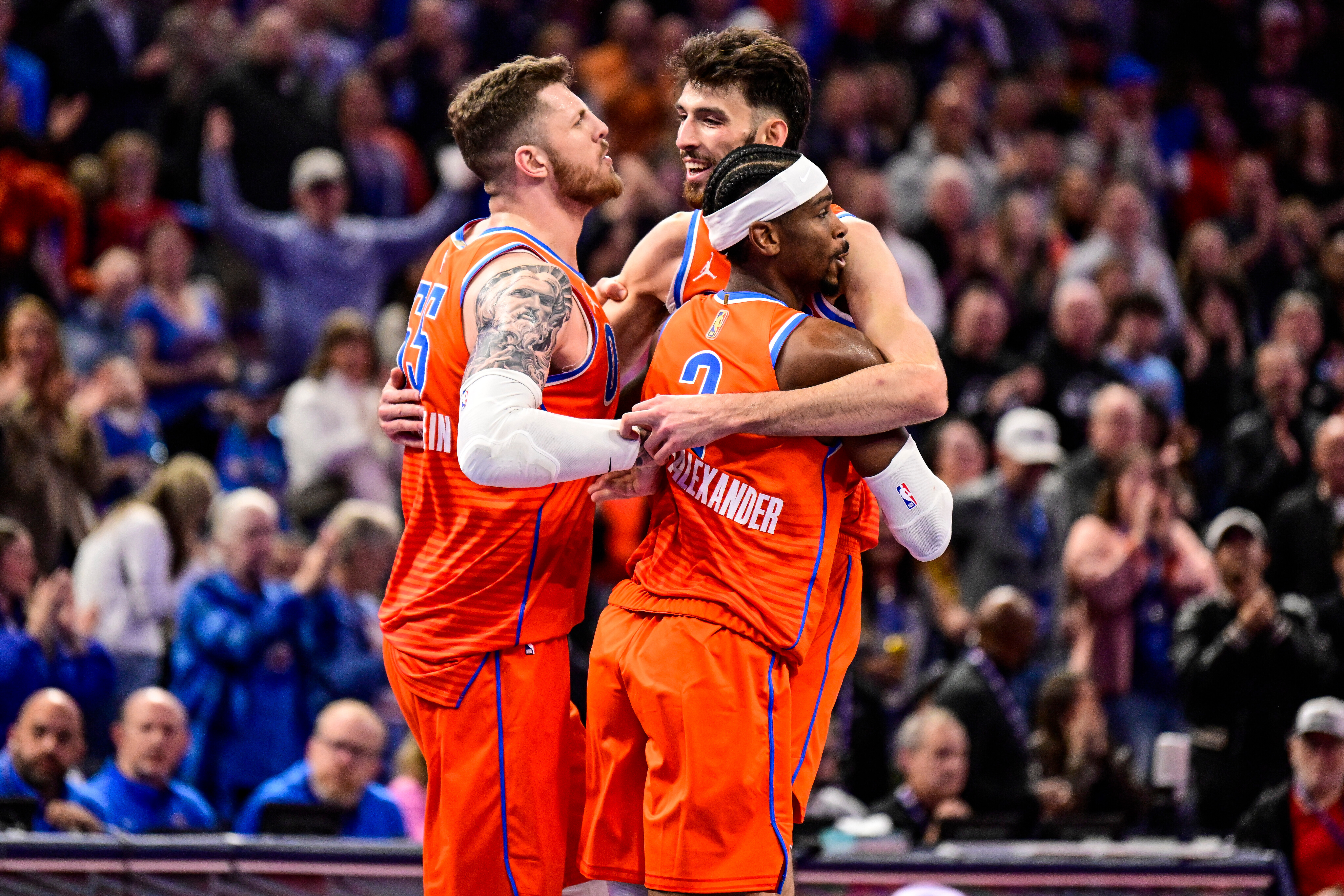 Oklahoma City Thunder center/forward Chet Holmgren (7), center, celebrates with Oklahoma City Thunder center/forward Isaiah Hartenstein (55) and Oklahoma City Thunder guard Shai Gilgeous-Alexander (2) during the second half of an Emirates NBA Cup basketball game, Wednesday, Nov. 26, 2025, in Oklahoma City.