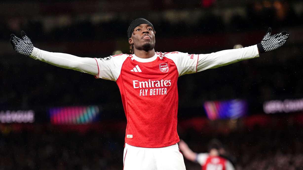 Arsenal's Noni Madueke celebrates after scoring his side's second goal during the Champions League opening phase soccer match between Arsenal and Bayern Munich in London, Wednesday, Nov. 26, 2025.
