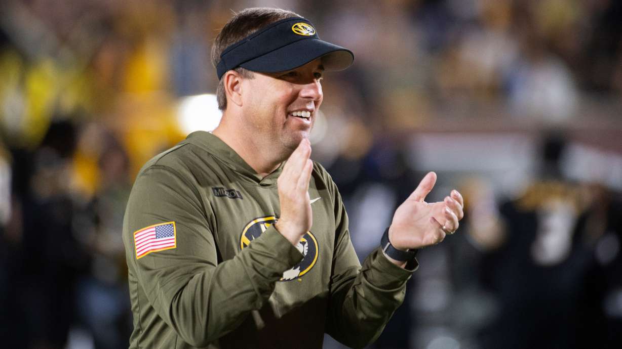 Missouri head coach Eli Drinkwitz claps during the first half of an NCAA college football game against Mississippi State, Saturday, Nov. 15, 2025, in Columbia, Mo.