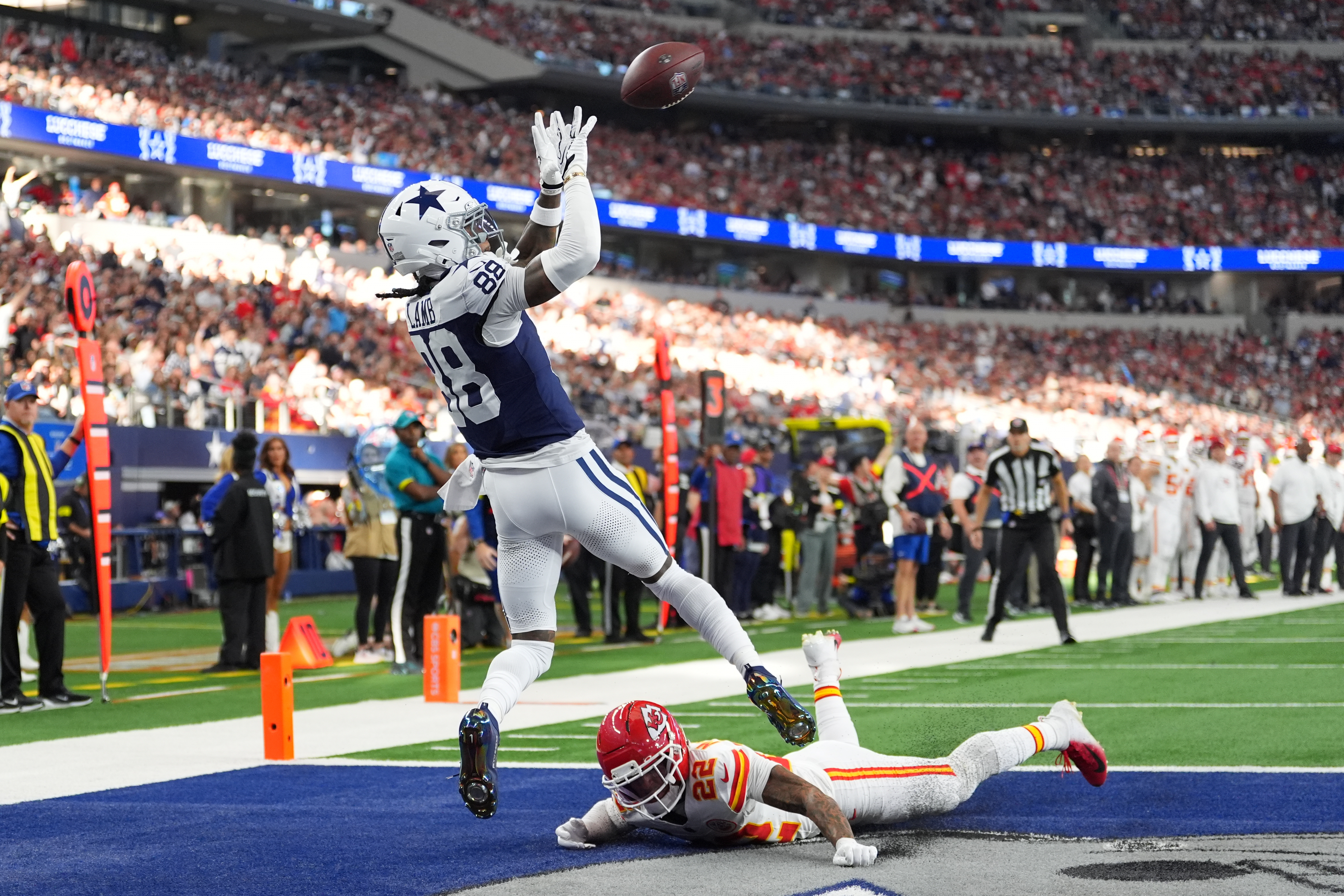 Dallas Cowboys wide receiver CeeDee Lamb (88) catches a touchdown pass as Kansas City Chiefs cornerback Trent McDuffie (22) defends during the first half of an NFL football game Thursday, Nov. 27, 2025, in Arlington, Texas. 