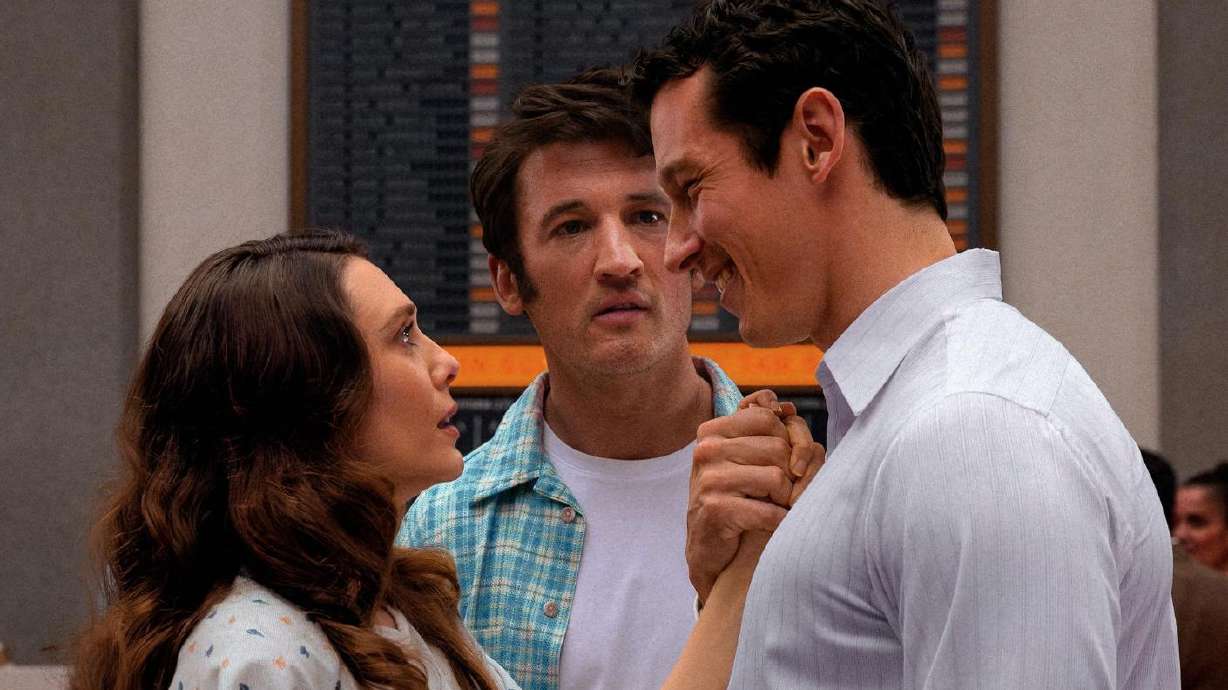 Elizabeth Olsen, Mike Teller and Callum Turner in a scene of
"Eternity."