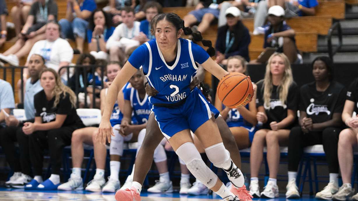 BYU guard Sydney Benally looks to pass against Virginia Tech during an NCAA women's basketball game, Thursday, Nov. 27, 2025 at the Paradise Jam in the U.S. Virgin Islands.